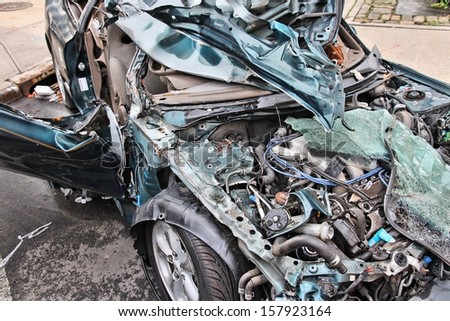 Generic compact car damaged in a rollover accident. Car crash wreck - insurance concept.