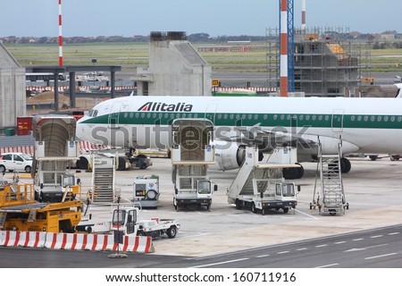 ROME - APRIL 11: Airbus A321 of Alitalia at Fiumicino Airport on April 11, 2012 in Rome. Alitalia had 3.59 bn EUR revenue in 2012, but suffered net loss.