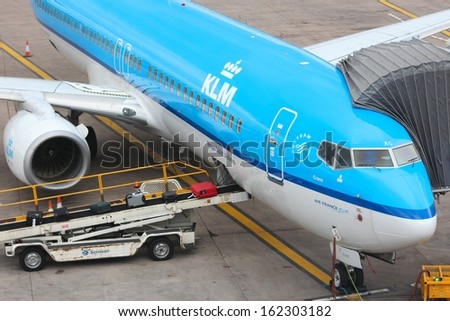 BIRMINGHAM, UK - APRIL 24: People board KLM Boeing 737 NG on April 24, 2013 at Birmingham Airport, UK. KLM employs more than 31 thousand people. It carried 25.8 million passengers in 2012.