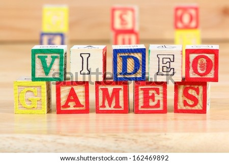 Wooden blocks with letters. Children educational toy concept - kids and video games.