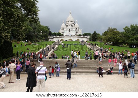 PARIS - JULY 22: Tourists stroll in Montmartre district on July 22, 2011 in Paris, France. Monmartre area is popular among tourists in Paris, the most visited city worldwide.