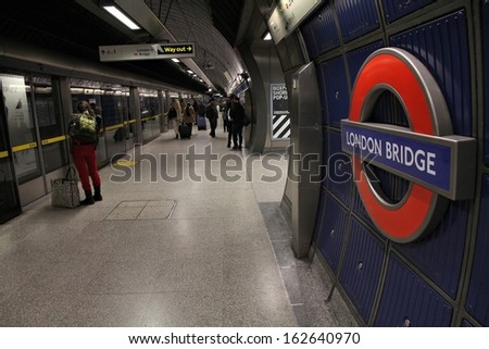 LONDON - MAY 13: Travelers wait at London Bridge underground station on May 13, 2012 in London. London Underground is the 11th busiest metro system worldwide with 1.1 billion annual rides.