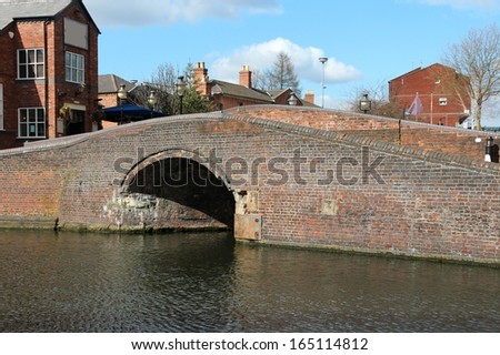 Birmingham water canal network - brick footbridge. West Midlands, England.