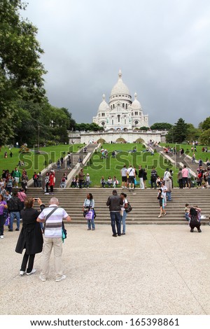 PARIS - JULY 22: Tourists stroll in Montmartre district on July 22, 2011 in Paris, France. Paris is the most visited city in the world with 15.6 million international arrivals in 2011.