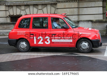 LONDON - MAY 14: Taxi driver waits on May 14, 2012 in London. As of 2012, there were 24,000 licensed taxi cabs in London.