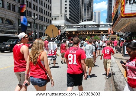 CHICAGO - JUNE 28: Blackhawks fans celebrate Stanley\'s Cup win on June 28, 2013 in Chicago. 2 million people celebrated the trophy in Chicago streets during team parade.