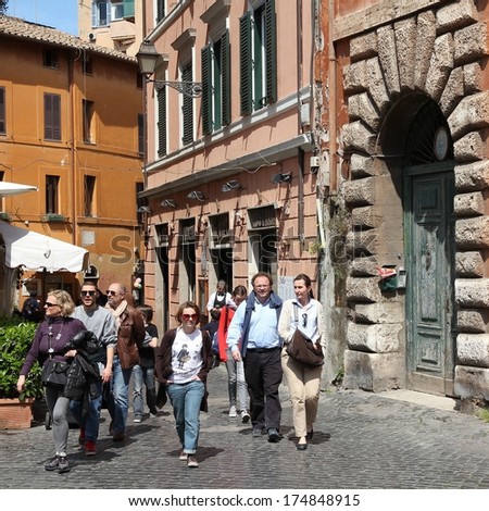 ROME - APRIL 10: Tourists visit old district Trastevere on April 10, 2012 in Rome. According to Euromonitor, Rome is the 3rd most visited city in Europe (5.5m international tourist arrivals 2009)