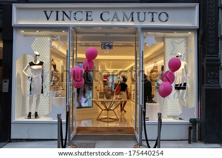 NEW YORK, USA - JULY 3, 2013: People visit Vince Camuto store in 5th Avenue, New York. 5th Avenue is ranked the most expensive retail area (per square foot) in the world.