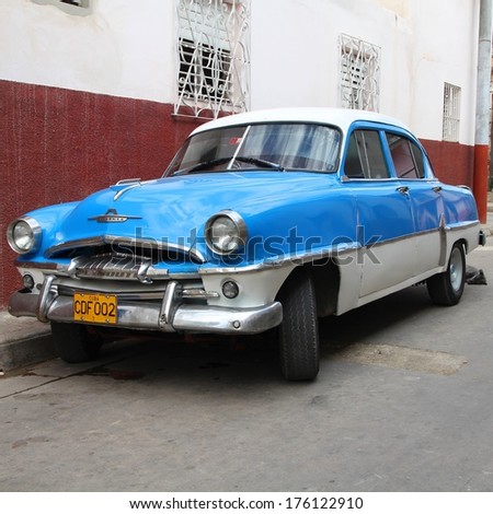 CAMAGUEY, CUBA - FEBRUARY 18, 2011: Vintage Plymouth car parked in Camaguey. Cuba has one of the lowest car-per-capita rates (38 per 1000 people in 2008).