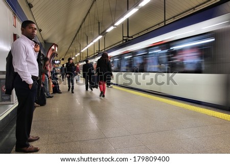 MADRID, SPAIN - OCTOBER 23, 2012: People wait for Madrid Metro. Madrid Metro has annual ridership of 634 million passengers (2011).