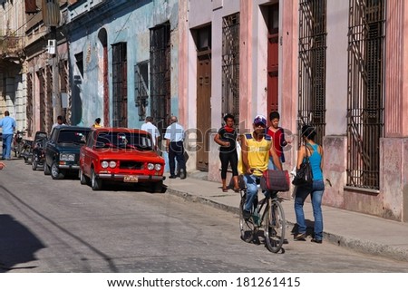 CAMAGUEY, CUBA - FEBRUARY 17, 2011: People walk in the Old Town of  Camaguey, Cuba. Camaguey is the 3rd largest city in Cuba (321,000 people) and its Old Town is a UNESCO World Heritage Site.