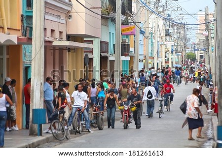 CAMAGUEY, CUBA - FEBRUARY 17, 2011: Crowds of people walk in Camaguey, Cuba. Camaguey is the 3rd largest city in Cuba (321,000 people) and its Old Town is a UNESCO World Heritage Site.