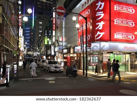 TOKYO, JAPAN - APRIL 13, 2012: People visit Yaesu neighborhood in Tokyo. Tokyo is the capital city of Japan, 35 million people live in its urban area.