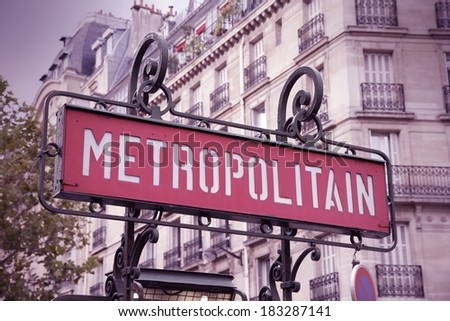 Paris, France - retro metro station sign. Subway train entrance. Retro filtered look - cross processing color tone.