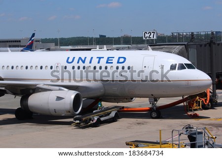 WASHINGTON, USA - JUNE 15, 2013: People board United Airlines Airbus A319 at Dulles International Airport in Washington, DC, USA. The airline had 400 million USD operating income in 2013.