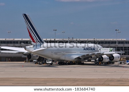 WASHINGTON, USA - JUNE 15, 2013: People board Air France Airbus A380 at Dulles International Airport in Washington, DC, USA. A380 is the largest passenger aircraft ever built.