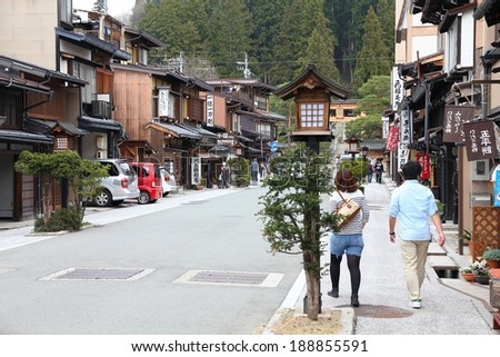 TAKAYAMA, JAPAN - APRIL 29, 2012: People visit the Old Town on April 29, 2012 in Takayama, Japan. Takayama is among top 25 tourism destinations in Japan according to Japan-Guide.com.