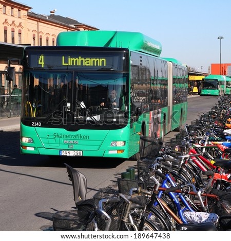 MALMO, SWEDEN - MARCH 8, 2011: MAN bus and bicycles in Malmo, Sweden. In 2009 MAN delivered 6,232 buses to customers. Cycling is major competition for public transport in Malmo.