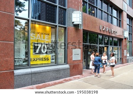 CHICAGO, USA - JUNE 26, 2013: Shoppers walk by Express fashion store at Magnificent Mile in Chicago. The Magnificent Mile is one of most prestigious shopping districts in the United States.