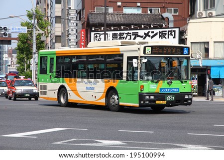 TOKYO, JAPAN - MAY 10, 2012: Commuters ride Toei Bus in Tokyo. Toei Bus is the main bus company in Tokyo. It had average 568,863 daily ridership in 2005.