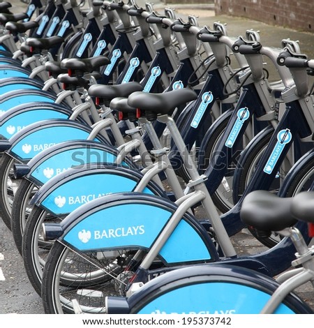 LONDON, UK - MAY 14, 2012: Community bikes hire in London. Barclays Cycle Hire is one of most successful city bike networks worldwide with 5000 bikes and 570 stations as of 2012.