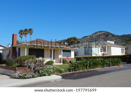 SAN LUIS OBISPO, USA - APRIL 7, 2014: Generic California residential homes as seen from public road in San Luis Obispo county. Real estate rates in California have grown 105 percent since 1990.