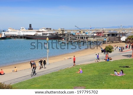 SAN FRANCISCO, USA - APRIL 8, 2014: People visit Aquatic Park in San Francisco, USA. San Francisco is the 4th most populous city in California (837,442 people in 2013).