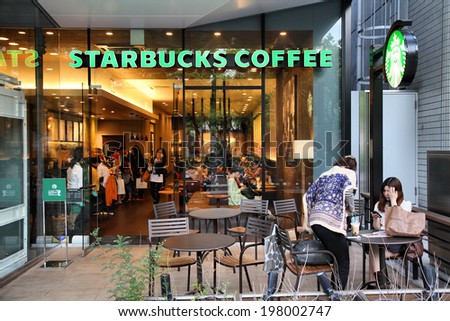 NAGOYA, JAPAN - MAY 3, 2012: People visit Starbucks Coffee in Nagoya, Japan. Starbucks is the largest coffeehouse company in the world, with 19,435 stores in 58 countries (2012).