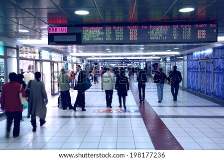ROME, ITALY - APRIL 9, 2012: People hurry at Termini Station in Rome. It exists since 1862 and is one of 3 busiest train stations in Europe. It serves 850 trains daily and about 150m people annually.