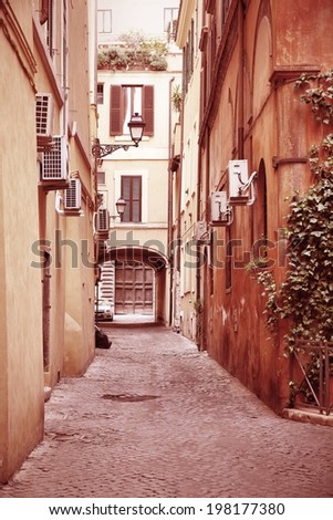 Old town street and Mediterranean architecture in Rome, Italy. Cross processed color style - retro image filtered tone.