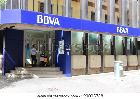SANTA CRUZ, SPAIN - OCTOBER 27, 2012: Customer visits BBVA bank in Santa Cruz de Tenerife, Spain. As of 2012, BBVA is the 2nd biggest bank in Spain with 107,000 employees.