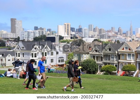 SAN FRANCISCO, USA - APRIL 9, 2014: People visit Alamo Square in San Francisco, USA. San Francisco is the 4th most populous city in California (837,442 people in 2013).