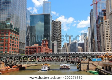 CHICAGO, USA - JUNE 28, 2013: Downtown view with Chicago River. Chicago is the 3rd most populous US city with 2.7 million residents (8.7 million in its urban area).