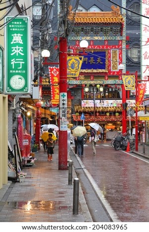 YOKOHAMA, JAPAN - MAY 10, 2012: Visitors walk Chinatown in Yokohama, Japan. Yokohama\'s Chinatown is the largest in Japan and a popular tourism attraction.