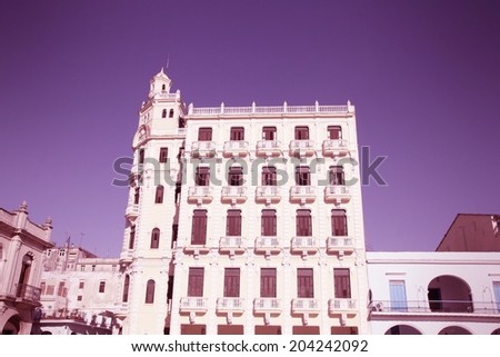 Havana, Cuba - architecture at famous Plaza Vieja square. Cross processed color tone - retro style filtered image.