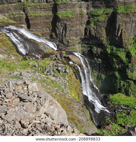 Glymur - tallest waterfall in Iceland. Beautiful mountain river canyon. Square composition.