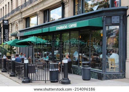 WASHINGTON, USA - JUNE 14, 2013: People relax at Starbucks Coffee in Washington, DC. Starbucks is the largest coffee house company in the world, it has 20,891 stores in 62 countries.