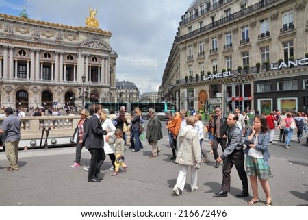 PARIS, FRANCE - JULY 22, 2011: Tourists visit Opera Garnier in Paris, France. Paris is the most visited city in the world with 15.6 million international arrivals in 2011.