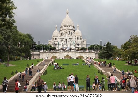 PARIS, FRANCE - JULY 22, 2011: Tourists stroll in Montmartre district in Paris, France. Paris is the most visited city in the world with 15.6 million international arrivals in 2011.