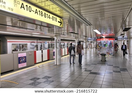 TOKYO, JAPAN - APRIL 13, 2012: People exit Tokyo Metro. With more than 3.1 billion annual passenger rides, Tokyo subway system is the busiest worldwide.