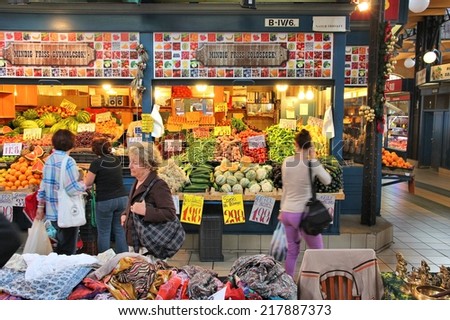 BUDAPEST, HUNGARY - JUNE 19, 2014: People visit Great Market Hall in Budapest. Opened in 1897, it remains the largest and oldest indoor market in Budapest.
