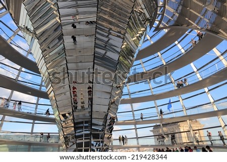 BERLIN, GERMANY - AUGUST 27, 2014: People visit Reichstag building dome in Berlin. The dome was completed in 1999. It was designed by architect Norman Foster.