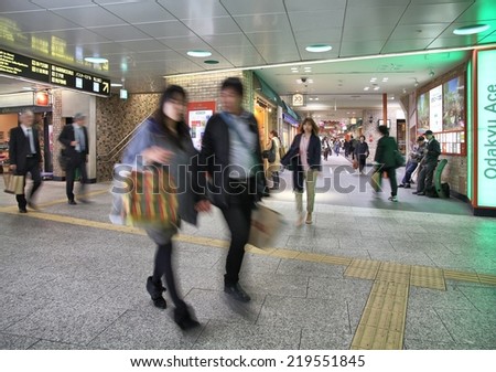TOKYO, JAPAN - APRIL 13, 2012: People hurry at Shinjuku Station in Tokyo. It is the world\'s busiest transport hub with daily usage by up to 3.64 million people.