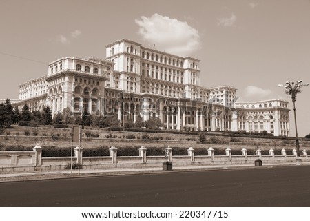 Bucharest, capital city of Romania. Palace of the Parliament (Romanian: Palatul Parlamentului). Sepia tone - filtered monochrome photo.