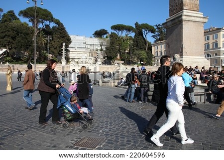 ROME, ITALY - APRIL 10, 2012: Tourists visit Piazza del Popolo in Rome. According to Euromonitor, Rome is the 3rd most visited city in Europe (5.5m international tourist arrivals 2009)