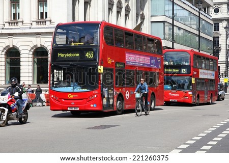 LONDON, UK - MAY 13, 2013: People ride London Buses in London. As of 2012, LB serves 19,000 bus stops with a fleet of 8000 buses. On a weekday 6 million rides are served.