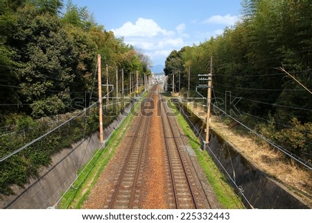 Kyoto, Japan - railroad tracks. Railway transportation infrastructure with electric lines.