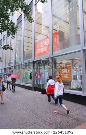 NEW YORK, USA - JULY 1, 2013: People walk by Joe Fresh store in 5th Avenue, New York. Joe Fresh has some 980 fashion stores in Canada and the US.