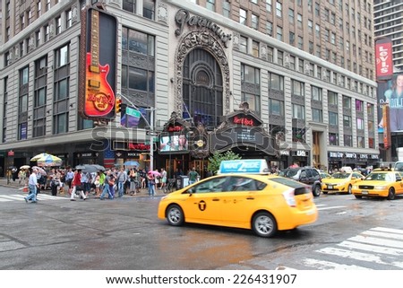 NEW YORK, USA - JULY 1, 2013: People ride yellow taxi in Broadway in New York. As of 2012 there were 13,237 yellow taxi cabs registered in New York City.