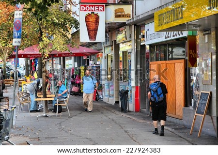 HAMBURG, GERMANY - AUGUST 28, 2014: People visit Reeperbahn in Hamburg. Reeperbahn area is Hamburg\'s famous red light district and entertainment area.